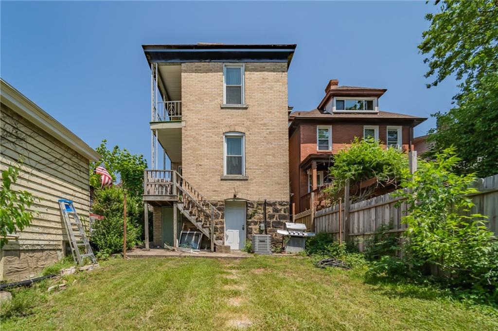 102 Secane Avenue Pittsburgh, PA 15211 - Photo 43 of 50 a front view of a house with a yard