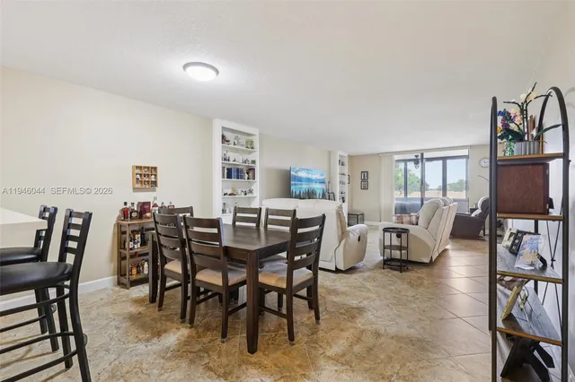 a kitchen with white cabinets and a sink