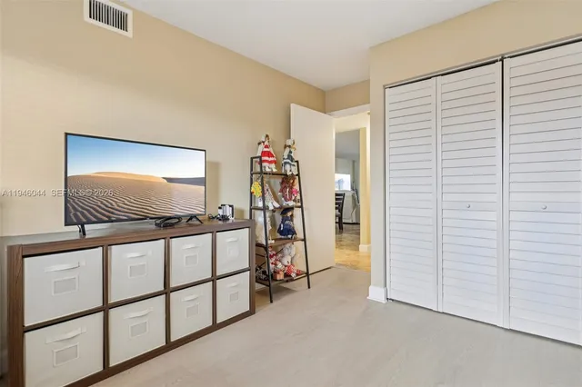 a work room with furniture and a window