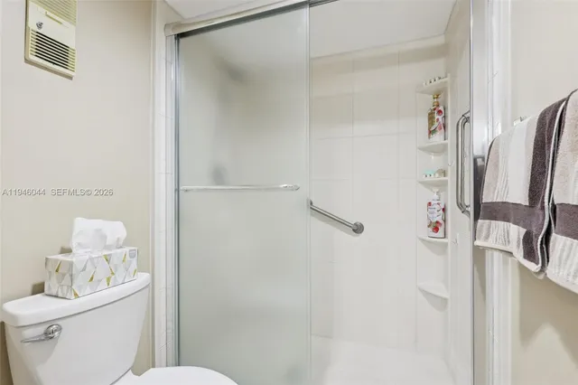 a room with furniture pool table flat screen tv and a table