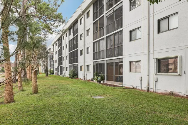 a view of a patio with a table and chairs