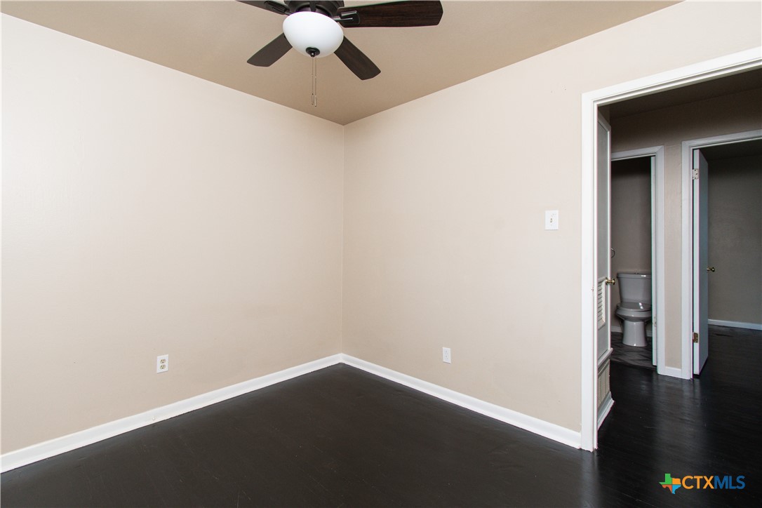 1312 Stephen Street Killeen, TX 76549 - Photo 9 of 19 a view of an empty room with wooden floor