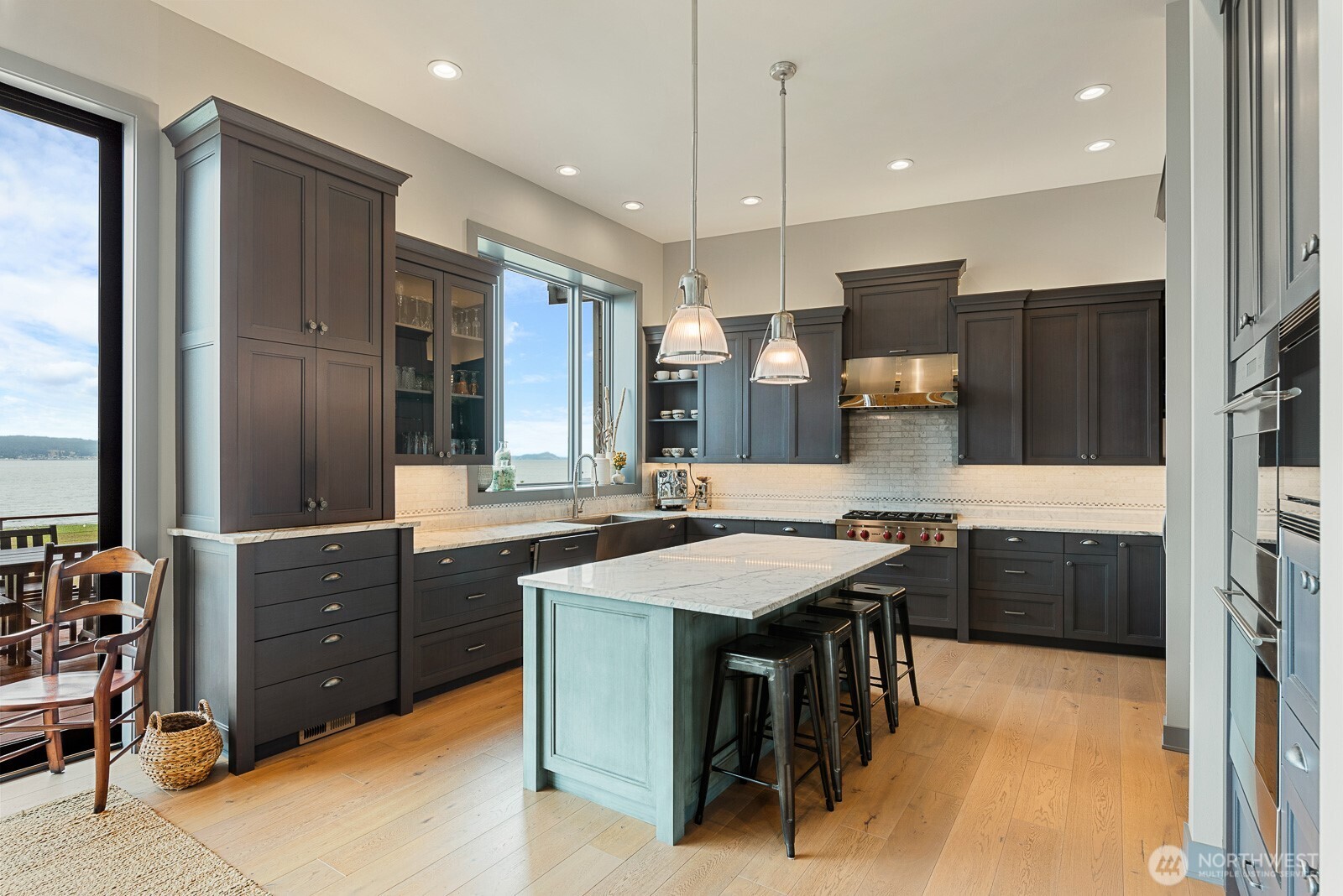181 Utsalady Road Camano Island, WA 98282 - Photo 13 of 40 a kitchen with a sink a counter space appliances and cabinets