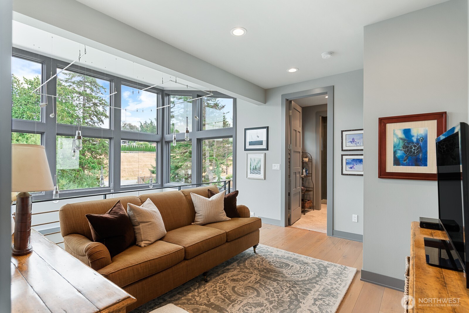181 Utsalady Road Camano Island, WA 98282 - Photo 27 of 40 a living room with furniture and a large window