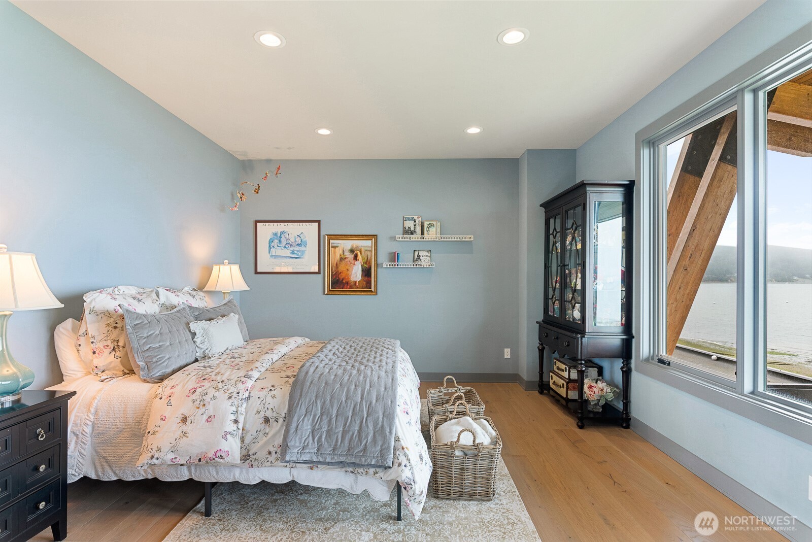 181 Utsalady Road Camano Island, WA 98282 - Photo 29 of 40 a bedroom with a bed and a large window