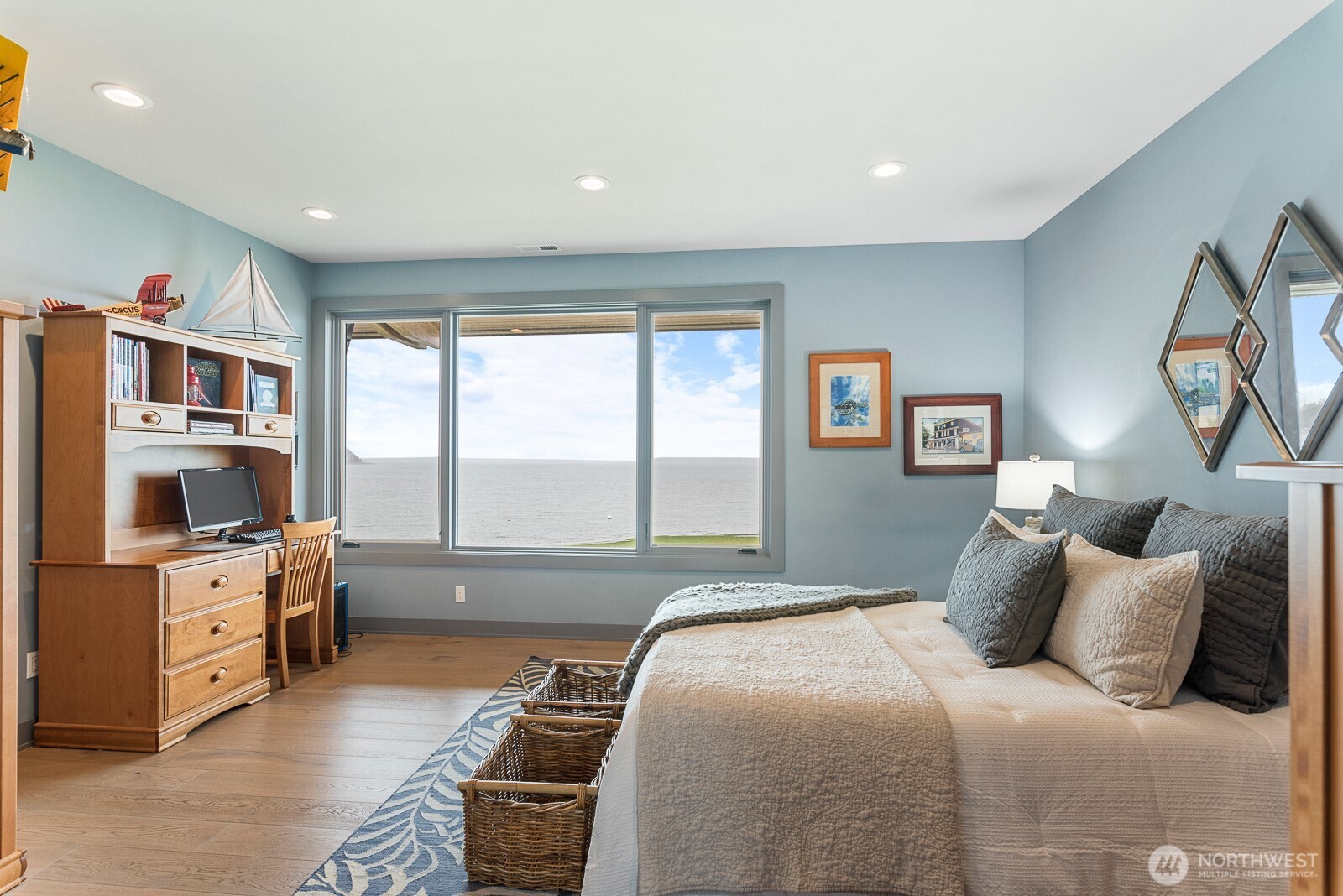 181 Utsalady Road Camano Island, WA 98282 - Photo 31 of 40 a bedroom with a bed and a flat tv screen