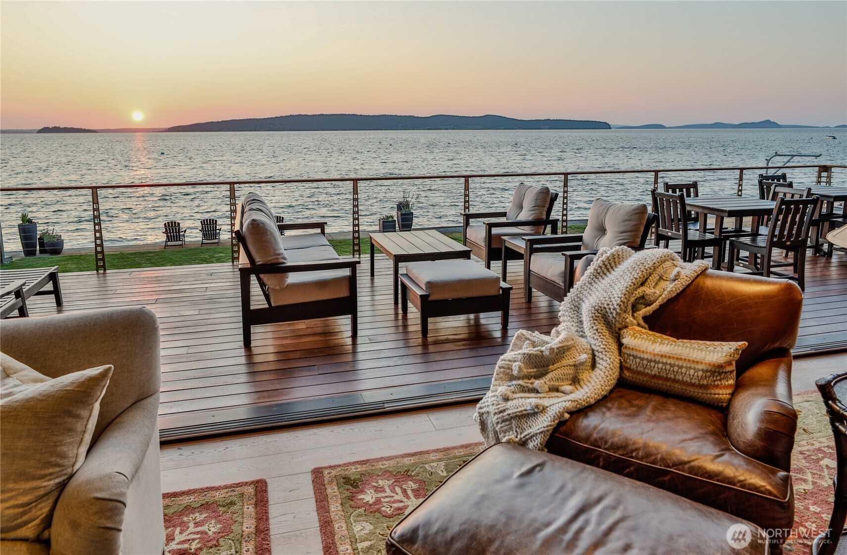 181 Utsalady Road Camano Island, WA 98282 - Photo 32 of 40 a roof deck with couches and wooden floor