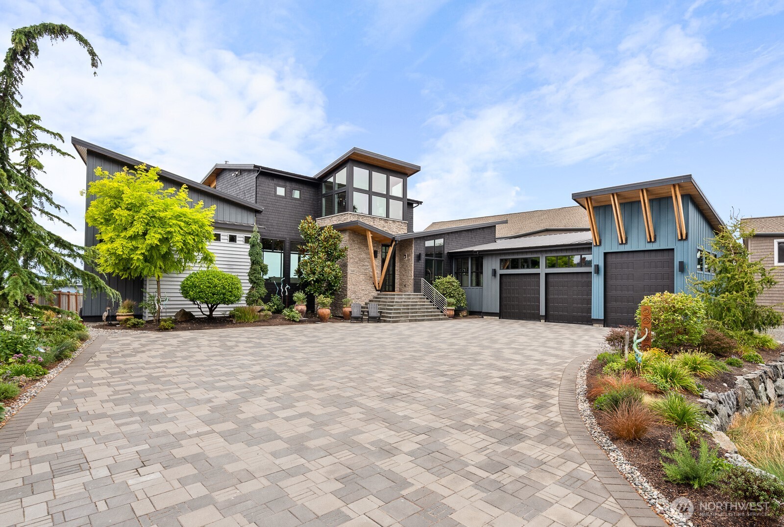 181 Utsalady Road Camano Island, WA 98282 - Photo 5 of 40 a front view of a house with a yard and potted plants