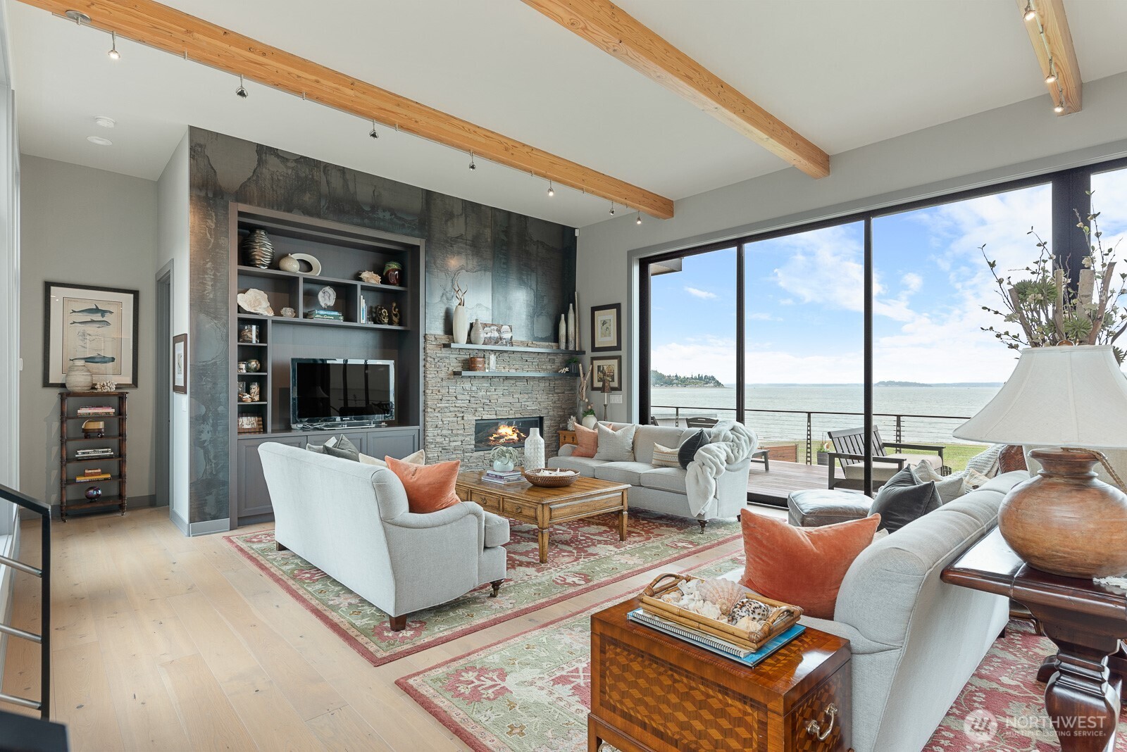 181 Utsalady Road Camano Island, WA 98282 - Photo 9 of 40 a living room with furniture a flat screen tv and a large window