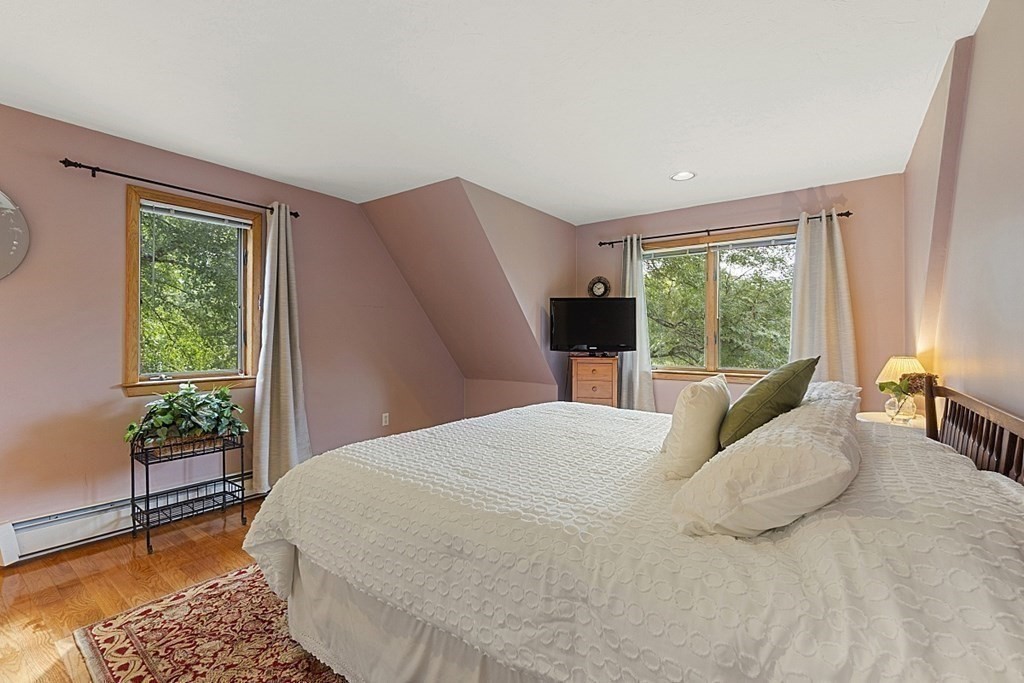 235 Pepperell Road Groton, MA 01450 - Photo 23 of 41 a bedroom with a large bed and a window