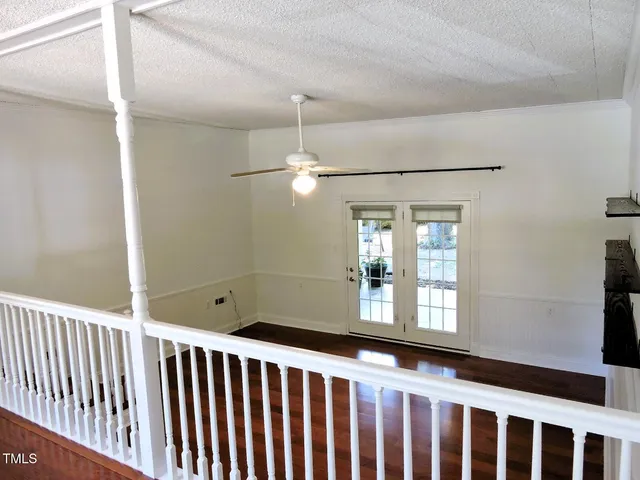 a bathroom with a window and a shower