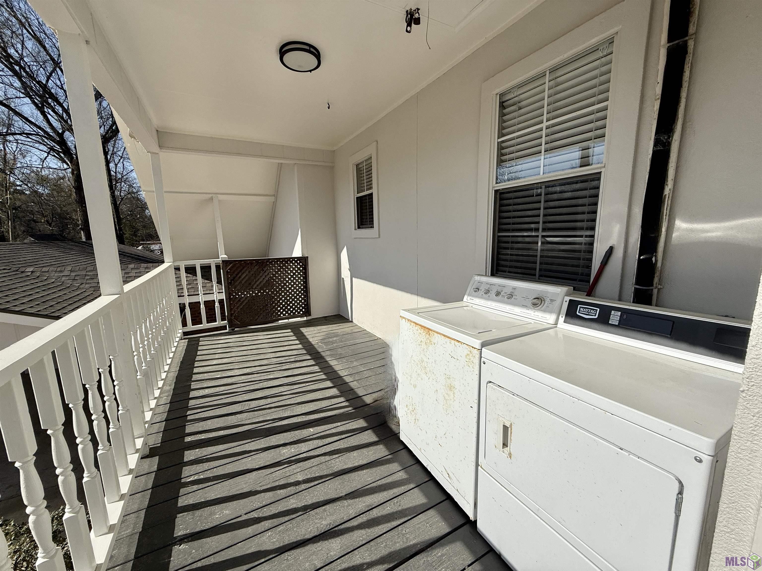 16706 Planchet Road Greenwell Springs, LA 70739 - Photo 7 of 14 SHARED LAUNDRY FOR APARTMENTS AND PRIVATE ENTRY FOR UPSTAIRS APARTMENT