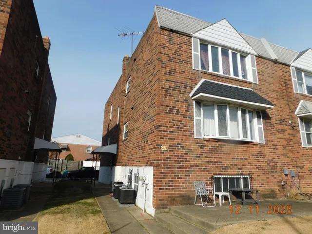 a front view of a house with glass windows