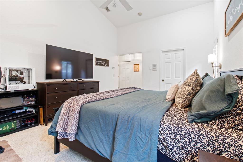 5301 Merrifield Court Spring Hill, FL 34608 - Photo 13 of 46 a bedroom with a bed and a flat screen tv