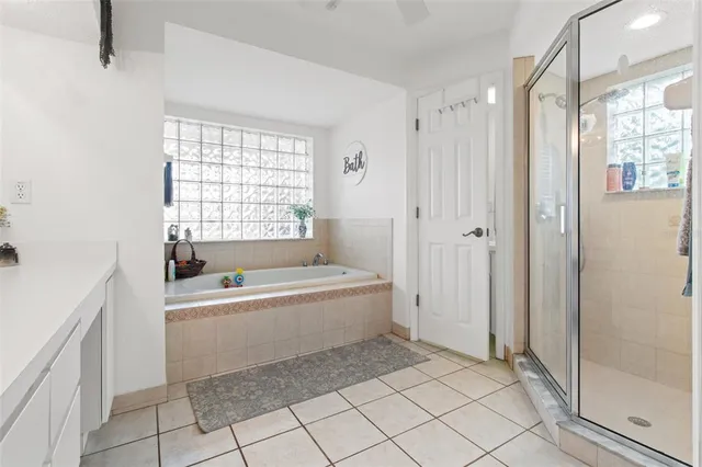 a bathroom with a bathtub and a shower