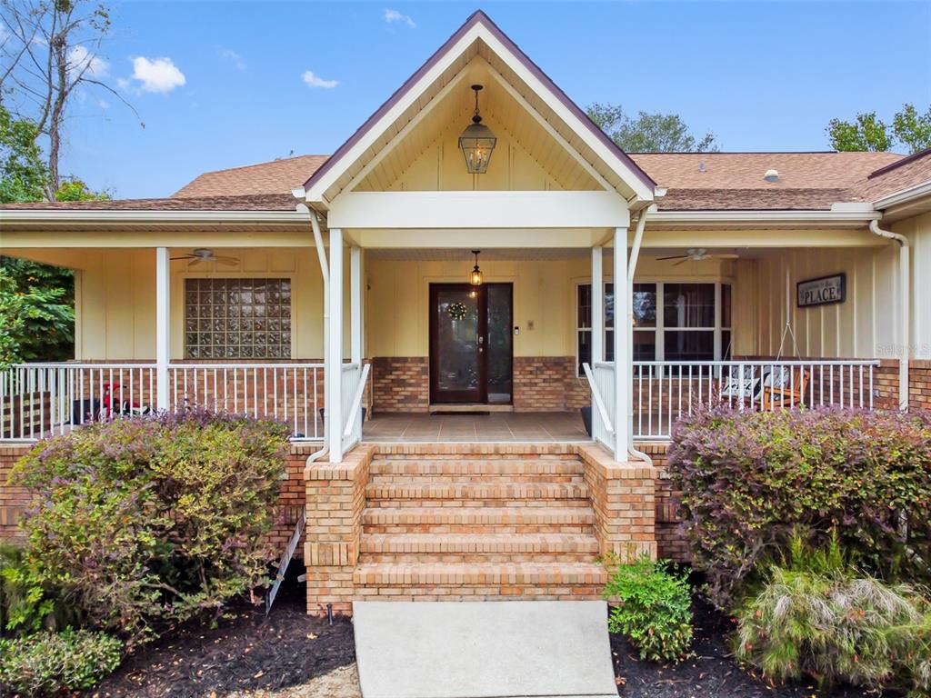 5301 Merrifield Court Spring Hill, FL 34608 - Photo 2 of 46 front view of a house with a porch