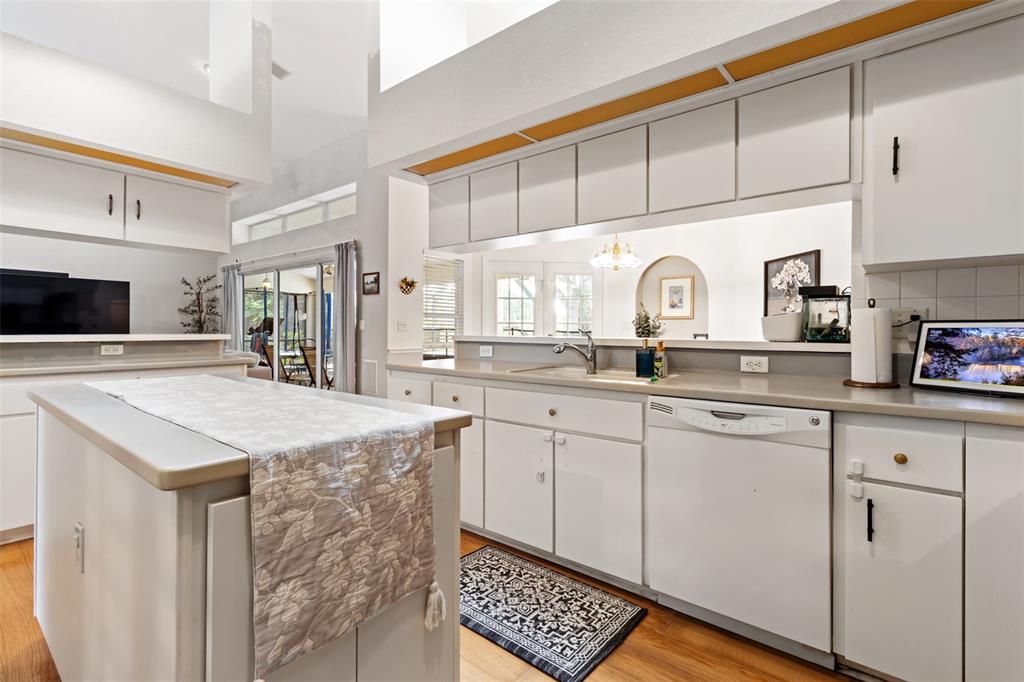 5301 Merrifield Court Spring Hill, FL 34608 - Photo 22 of 46 a kitchen with stainless steel appliances granite countertop a sink and cabinets