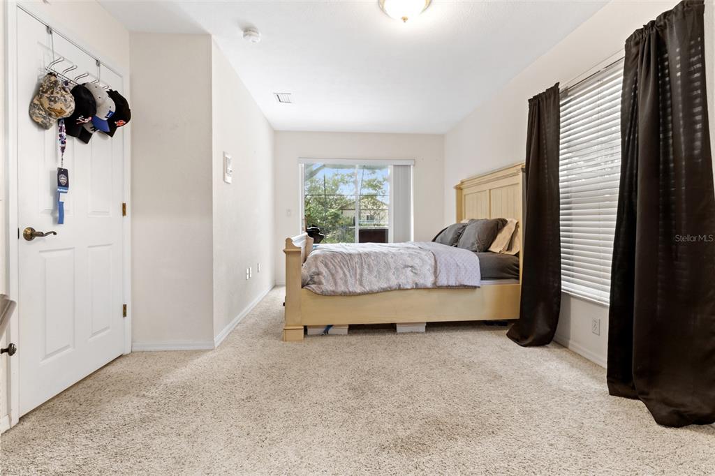 5301 Merrifield Court Spring Hill, FL 34608 - Photo 33 of 46 a bedroom with bed and a window