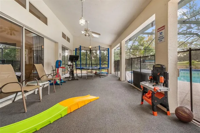 a living room with lots of furniture and air hockey table