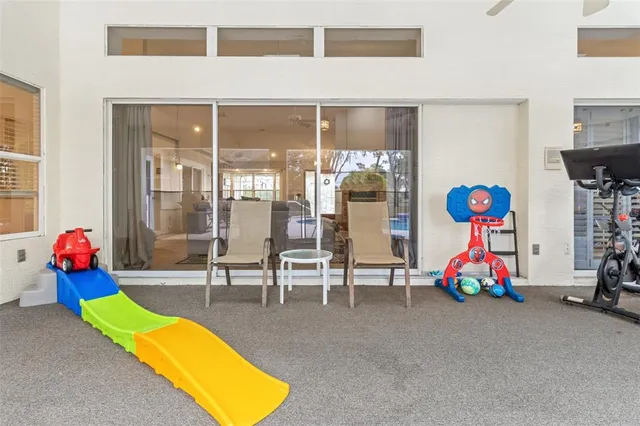 a view of swimming pool with a patio