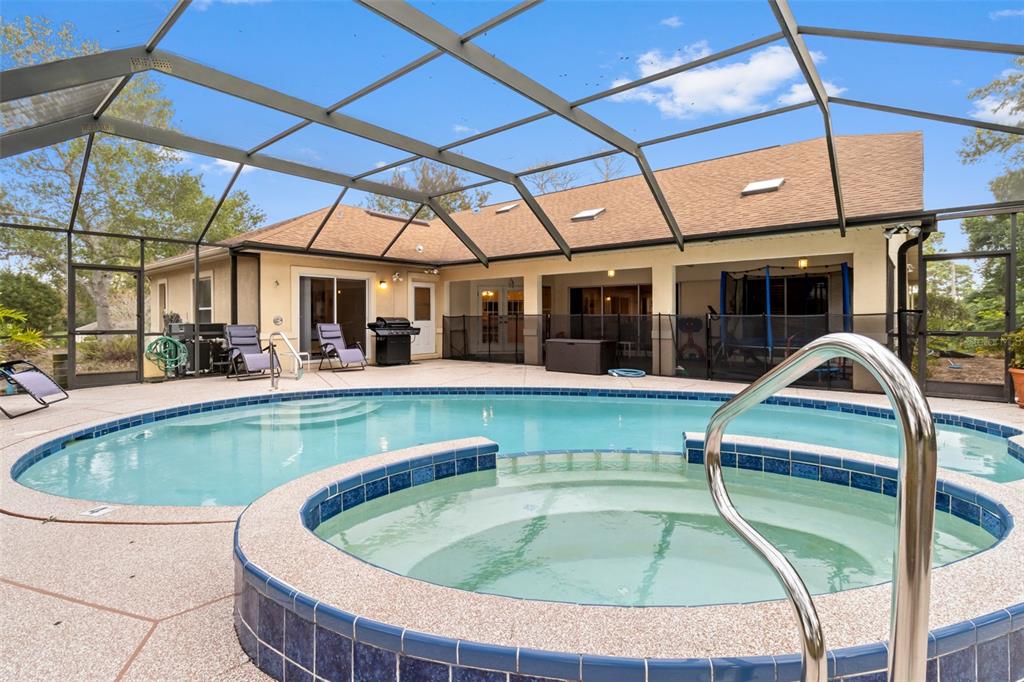 5301 Merrifield Court Spring Hill, FL 34608 - Photo 39 of 46 a view of swimming pool with seating area