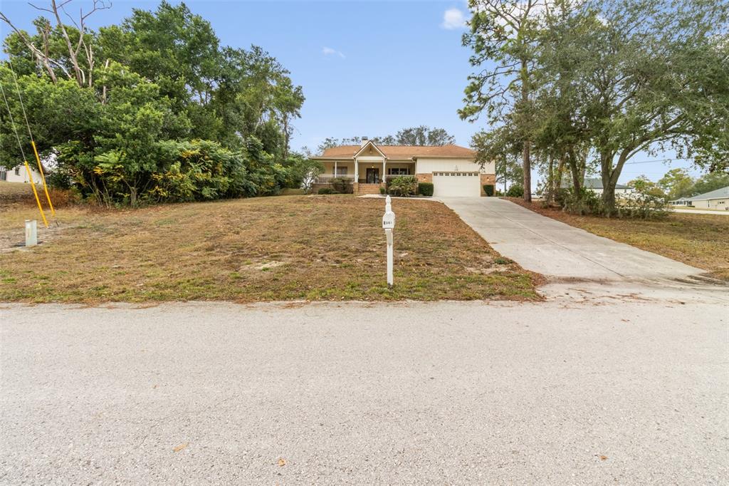 5301 Merrifield Court Spring Hill, FL 34608 - Photo 4 of 46 a view of a yard with trees