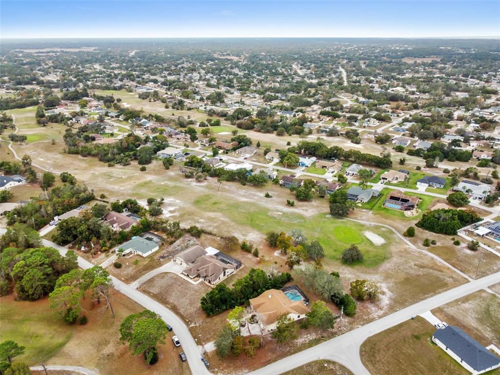 5301 Merrifield Court Spring Hill, FL 34608 - Photo 43 of 46 an aerial view of residential houses with outdoor space