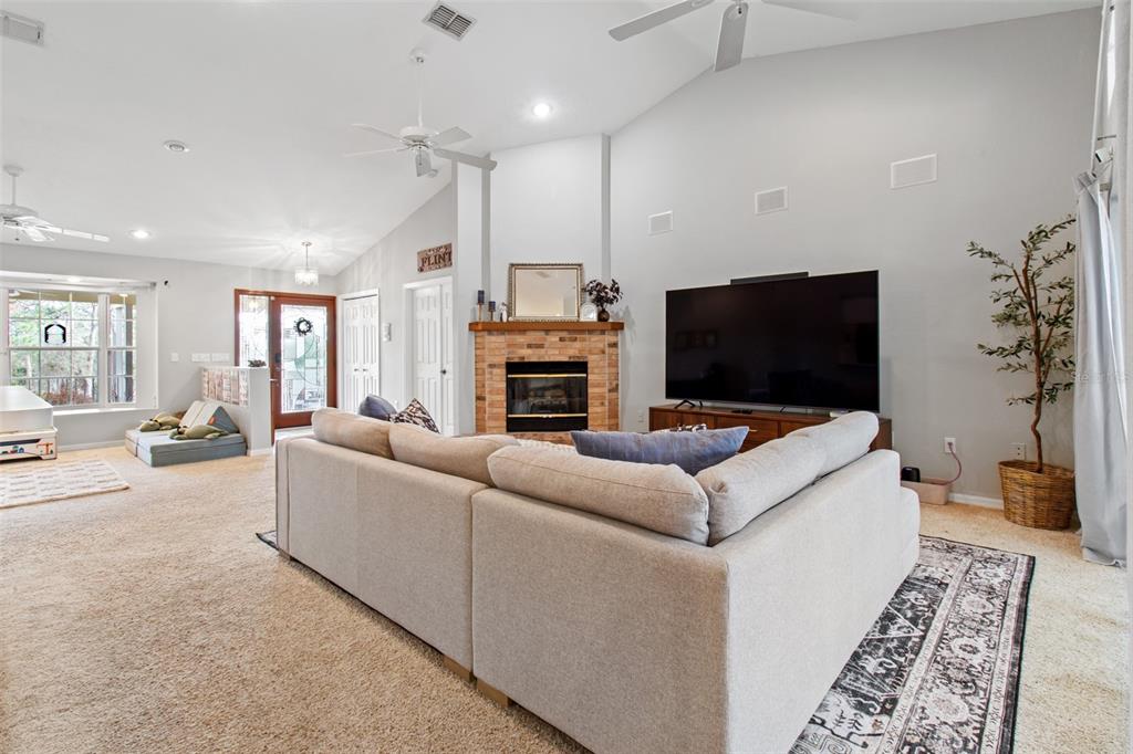5301 Merrifield Court Spring Hill, FL 34608 - Photo 10 of 46 a living room with furniture and a flat screen tv