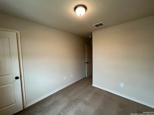 an empty room with a bathroom