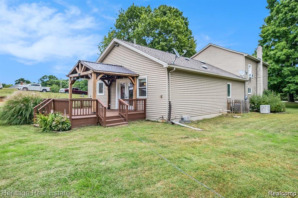 4694 Herd Road Metamora, MI 48455 - Photo 2 of 59 Back covered porch with deck