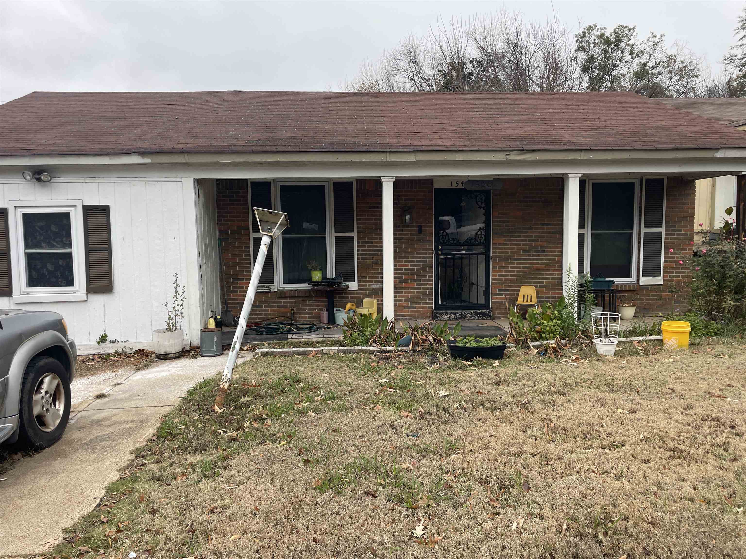 1540 Clementine Road Memphis, TN 38106 - Photo 2 of 2 a front view of a house with parking area