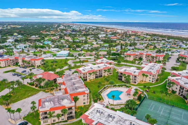a view of water with palm trees