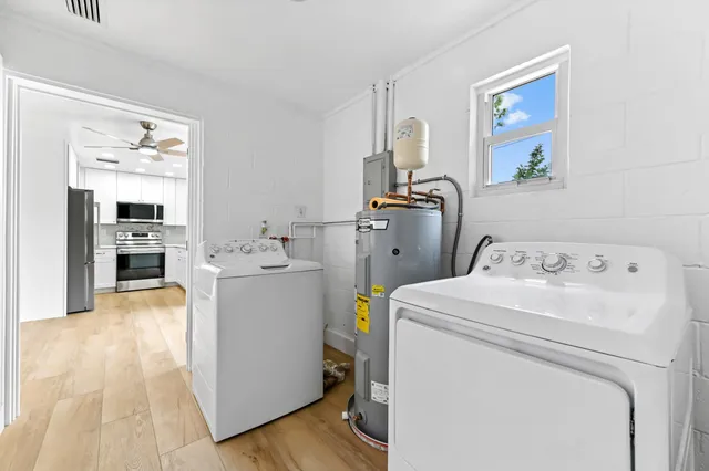 a utility room with dryer and washer