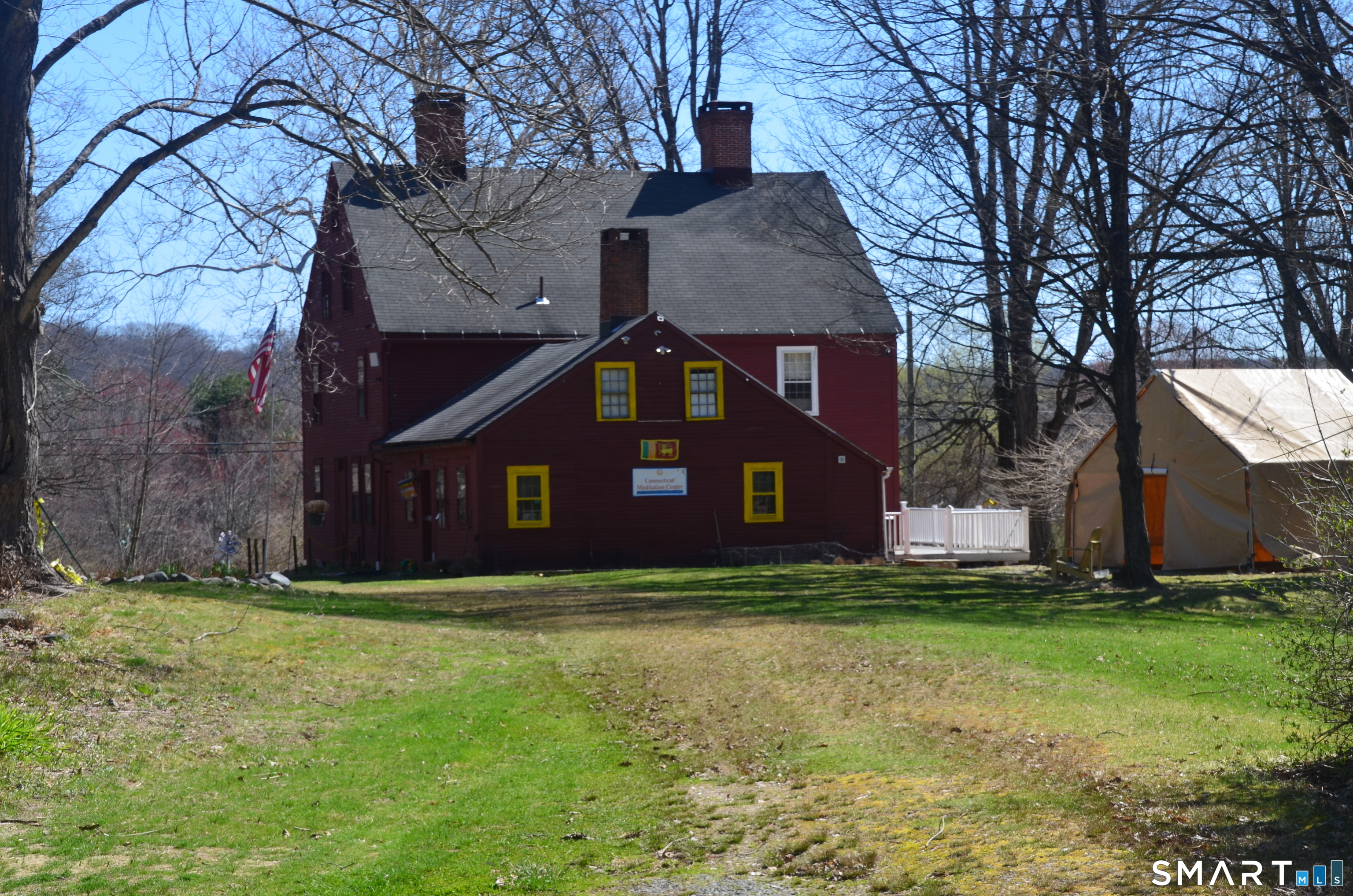 131 Highway 6 Andover, CT 06232 - Photo 11 of 12 a front view of house with yard and trees