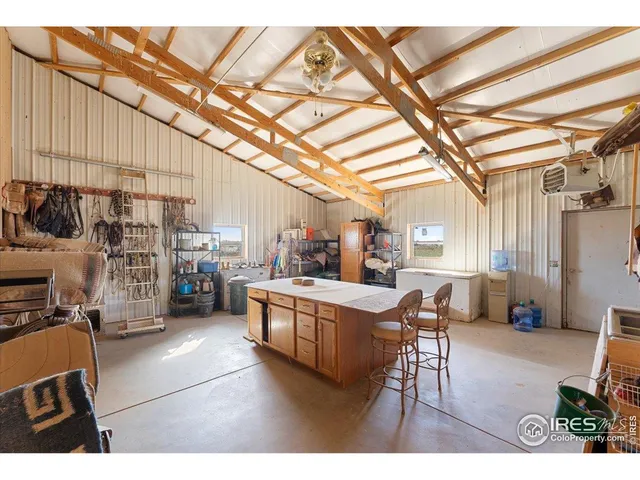 a living room with lots of furniture and clutter