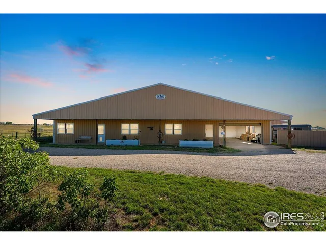 a view of a big house with a big yard