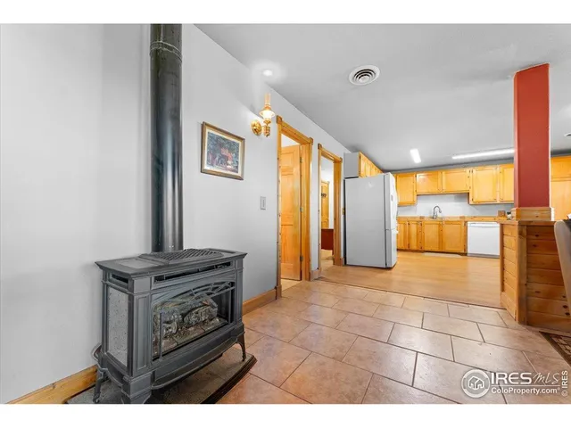a view of kitchen with furniture and large windows
