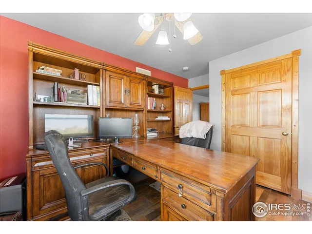 a kitchen view of a dining table chairs and chandelier