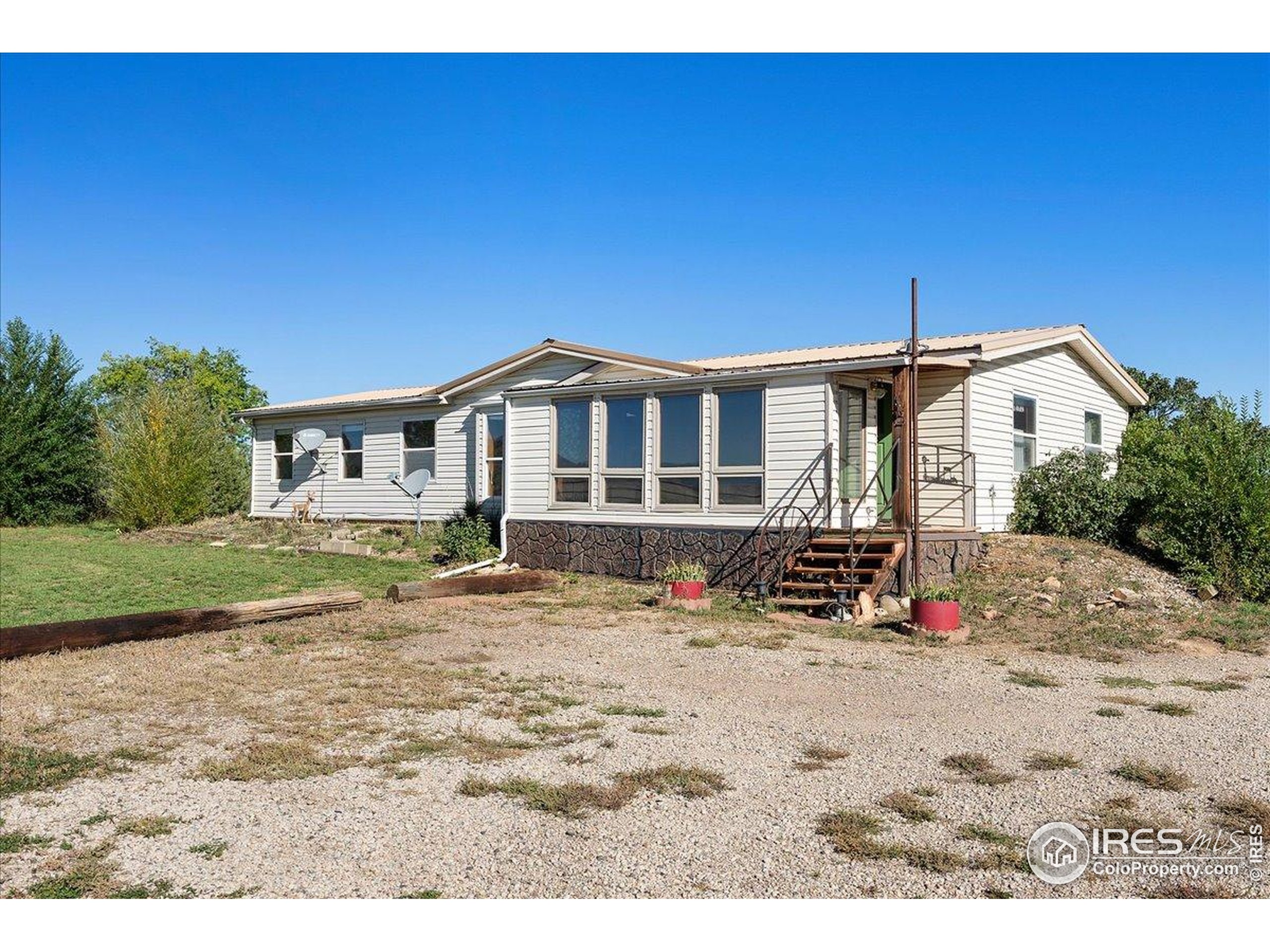 1721 West Co Road 68 Fort Collins, CO 80524 - Photo 31 of 50 a view of a house with a patio