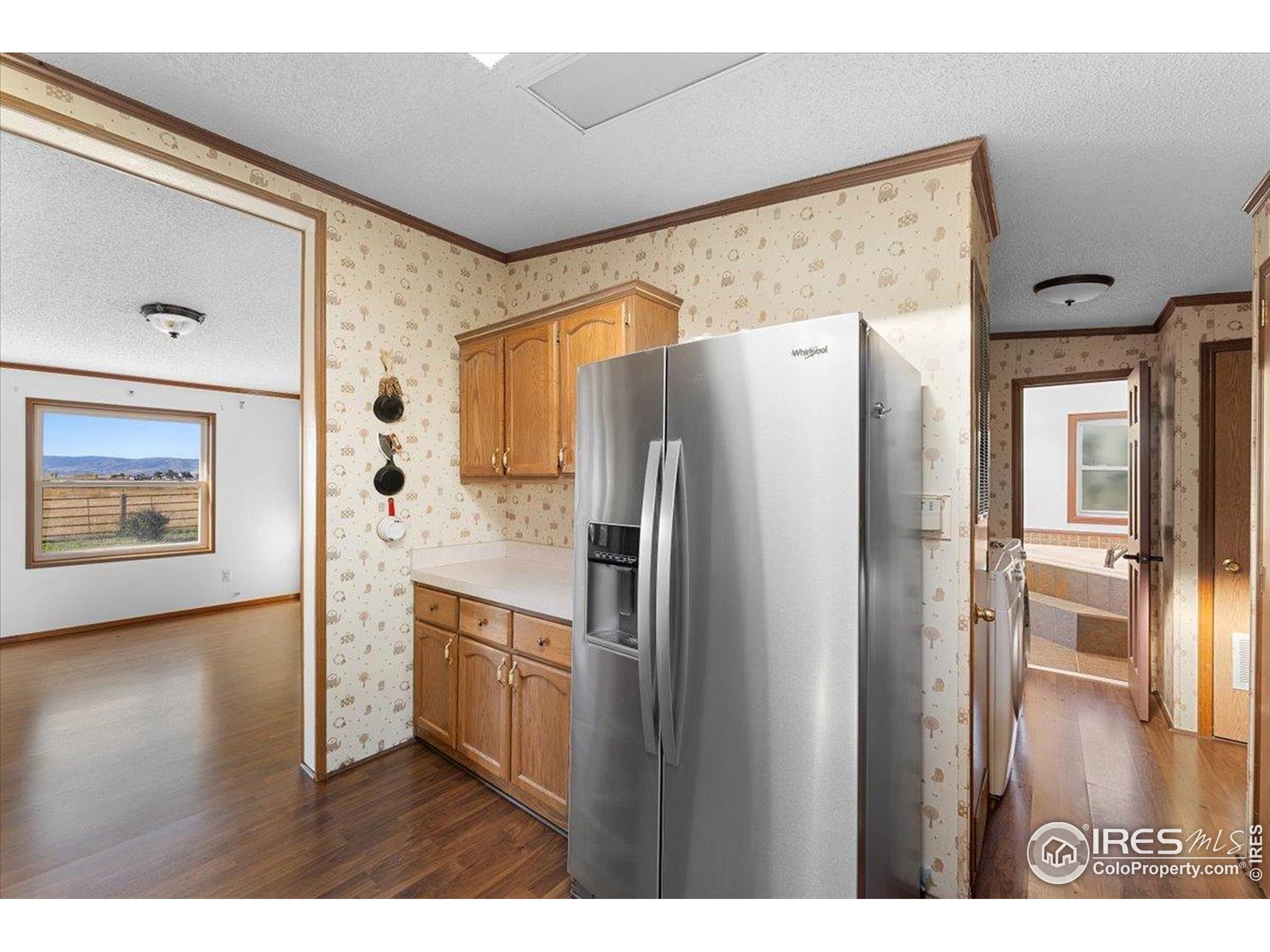 1721 West Co Road 68 Fort Collins, CO 80524 - Photo 35 of 50 a kitchen with stainless steel appliances a refrigerator and a refrigerator