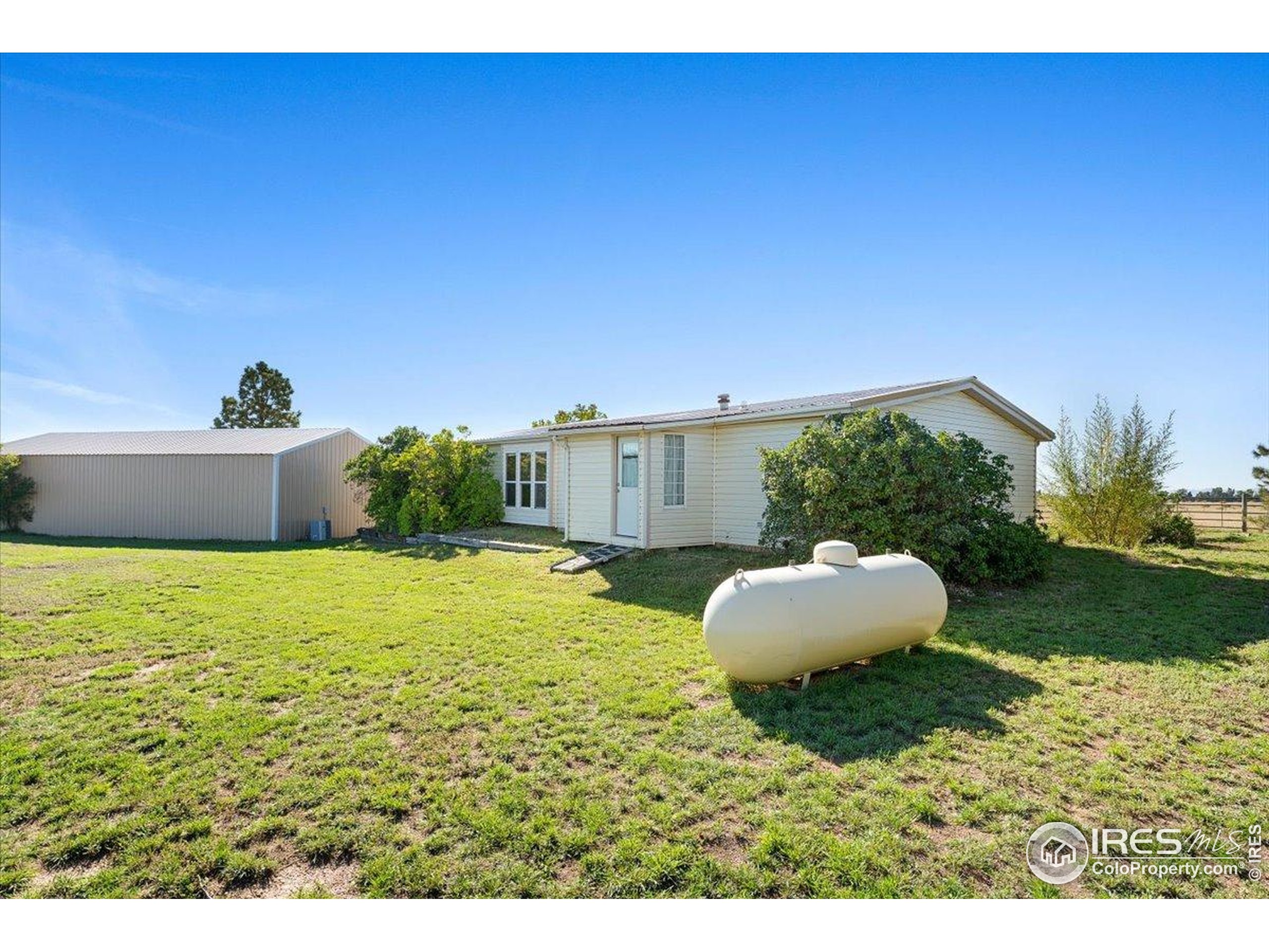 1721 West Co Road 68 Fort Collins, CO 80524 - Photo 49 of 50 a house view with a garden