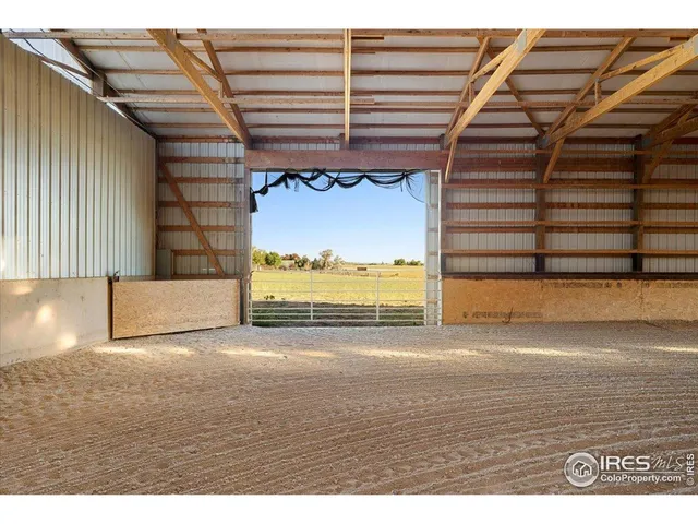 a view of a room with furniture and a window