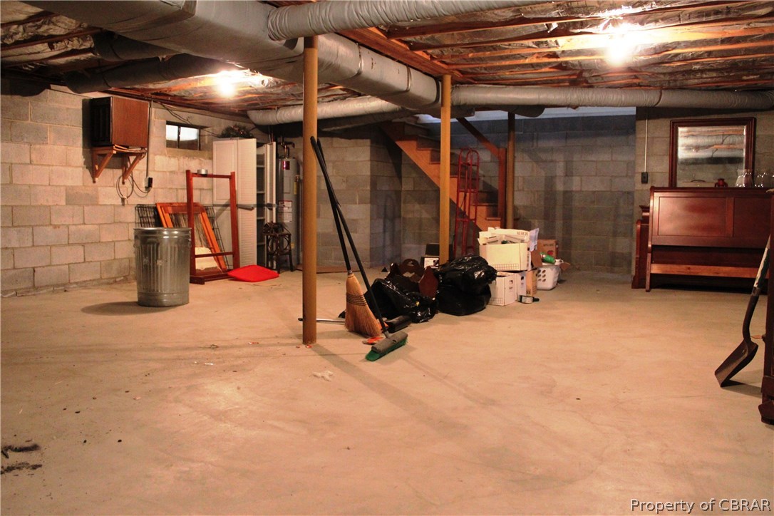 7449 Joseph Lewis Road Hayes, VA 23072 - Photo 11 of 32 Basement with dehumidifier provides excellent storage space or can be used as a rec room or hobby room. Excellent flex space!