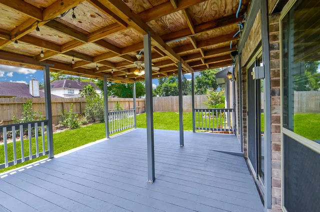 a view of a porch with wooden floor