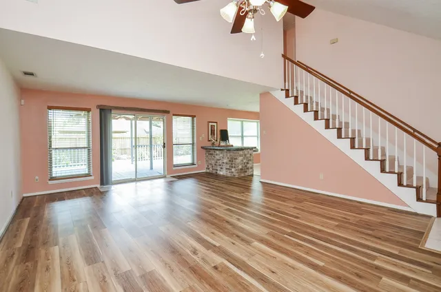 a view of an entryway with wooden floor