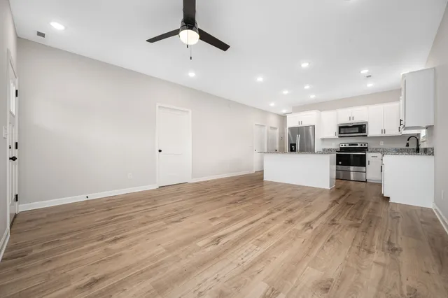 a view of kitchen with wooden floor