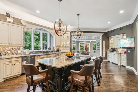 a view of a dining room with furniture window and outside view