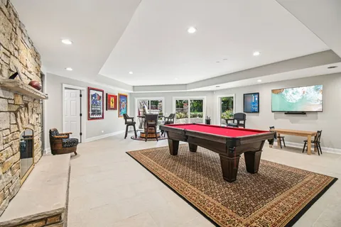 a view of a house with swimming pool and sitting area