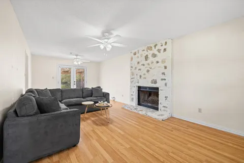 a living room with furniture and a fireplace