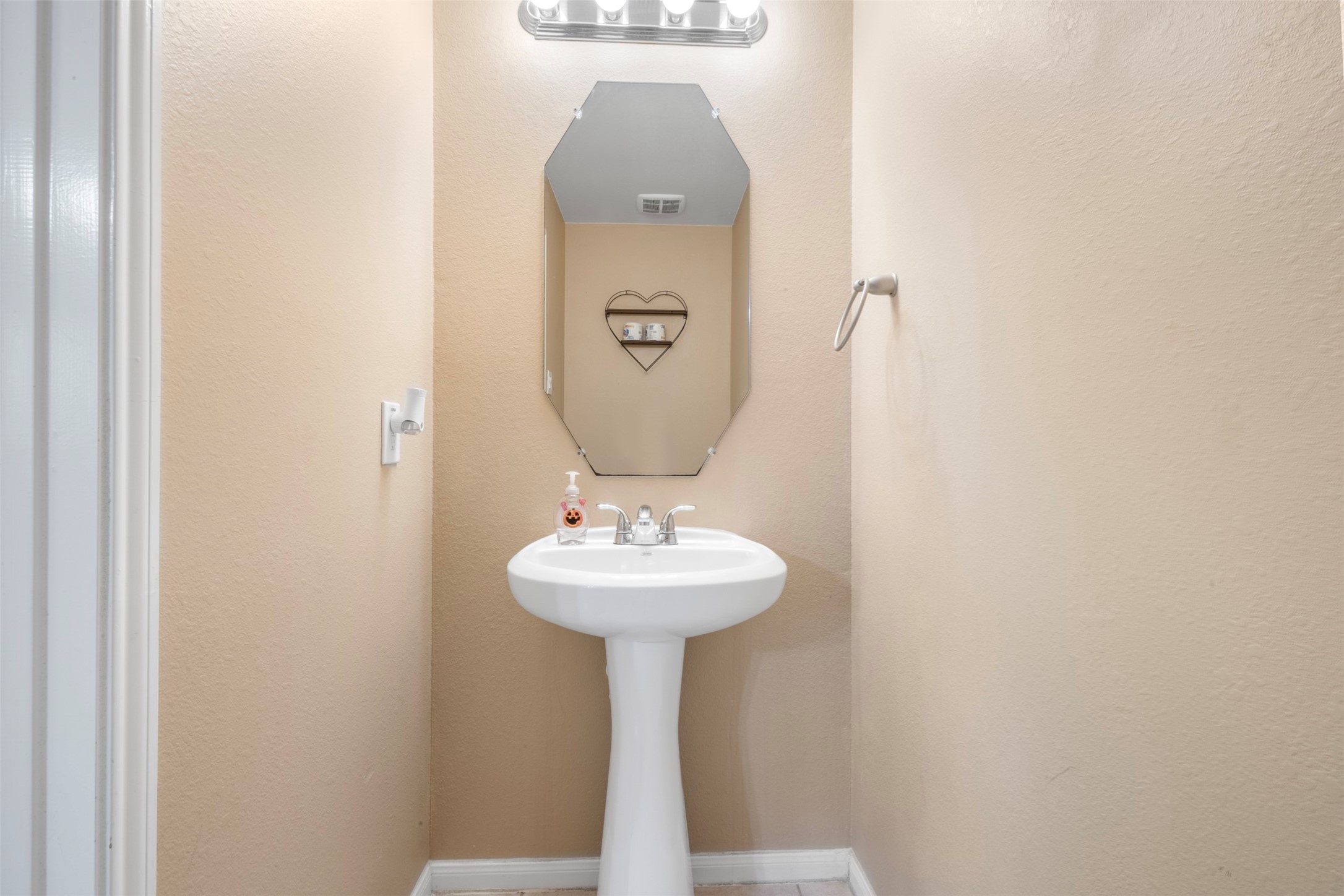 314 Gulf Winds Drive Bacliff, TX 77518 - Photo 11 of 24 a bathroom with a sink and a mirror